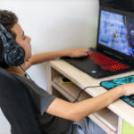 Middle school-aged child plays educational online learning game